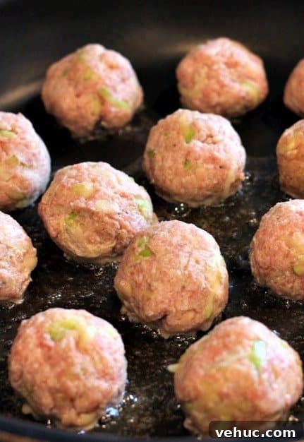 Turkey Zucchini Meatballs are made with fresh zucchini and lean ground turkey. The zucchini makes these meatballs super juicy and tender! turkey zucchini meatballs raw