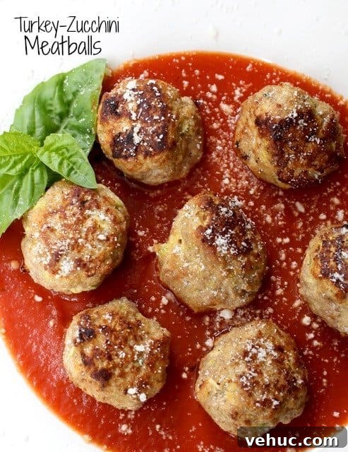 Turkey Zucchini Meatballs are made with fresh zucchini and lean ground turkey. The zucchini makes these meatballs super juicy and tender! turkey zucchini meatballs in sauce