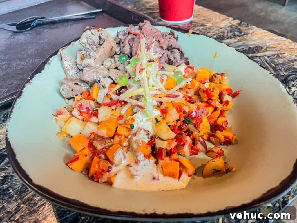 Top and Troubled Eats at Disney's Animal Kingdom: Restaurants Ranked 4 Beef and Chicken Combination bowl from Satu'li Canteen.