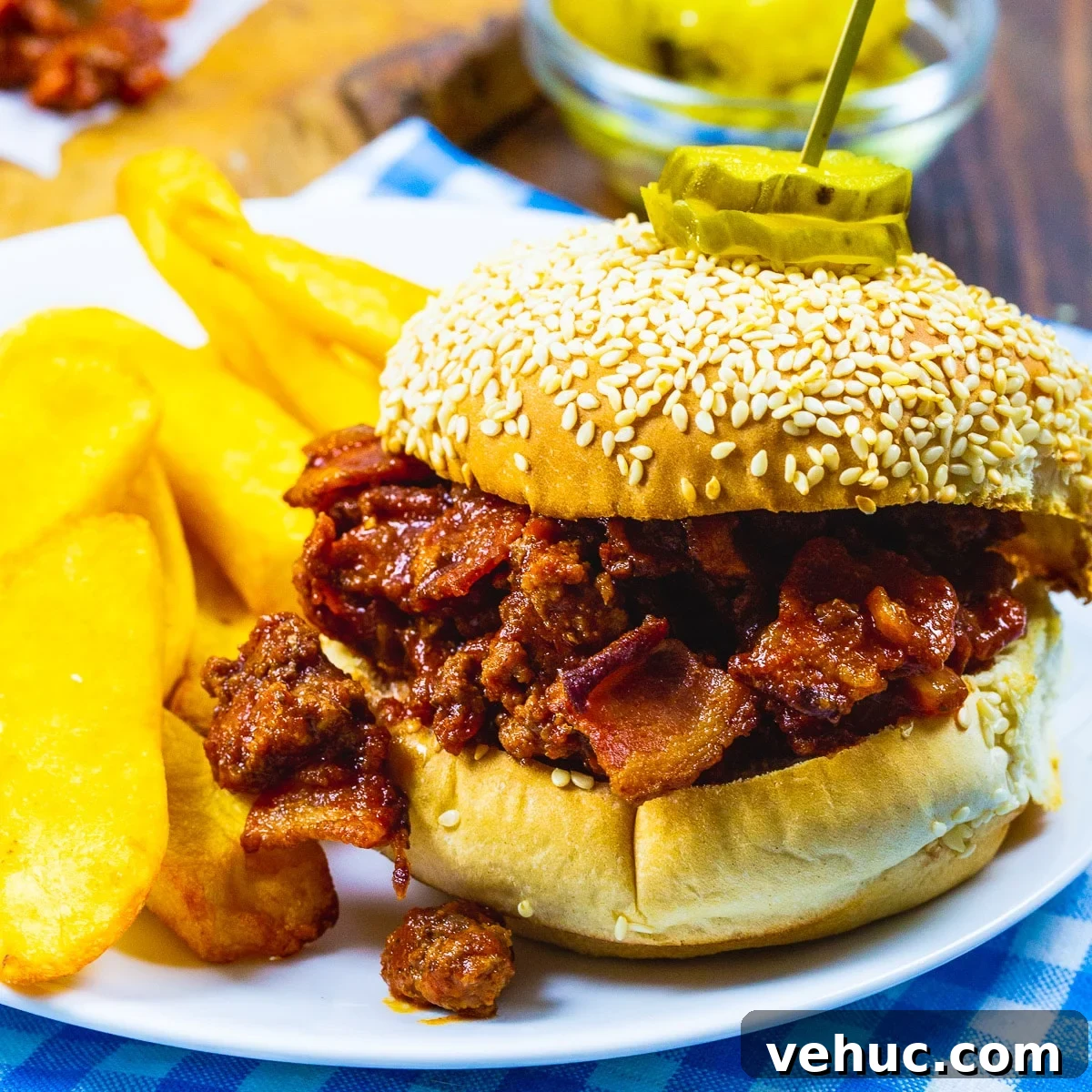 Brown Sugar Bacon Sloppy Joes on a plate with fries.