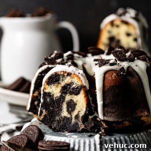 Decadent Oreo Pound Cake Recipe: Moist Cookies and Cream Loaf 15 oreo pound cake on a serving plate with a slice cut out