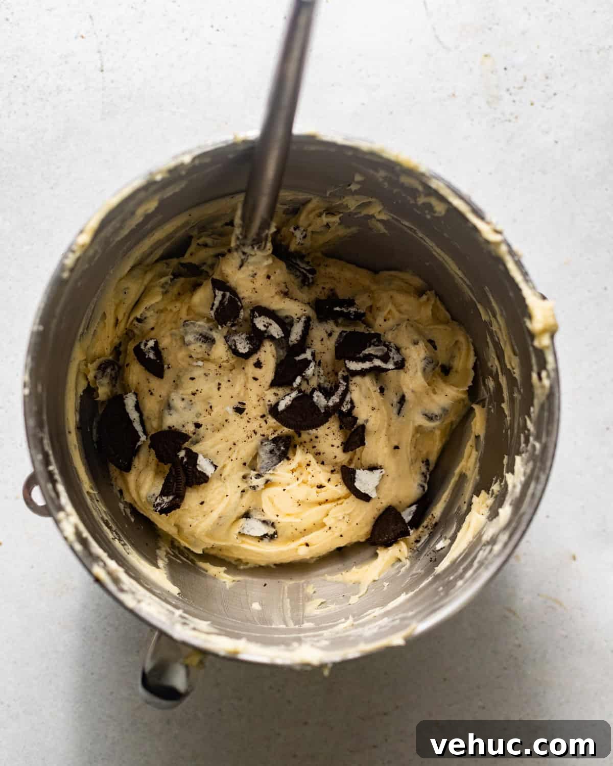 Decadent Oreo Pound Cake Recipe: Moist Cookies and Cream Loaf 7 mixing in crushed oreos to batter.