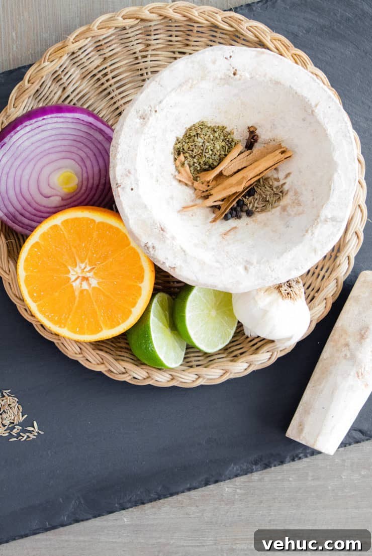 Authentic Cochinita Pibil Tacos Recipe — Yucatan Slow-Roasted Pork 5 Crushed oregano, cloves, cinnamon, peppercorns, cumin, and salt in a mortar and pestle.
