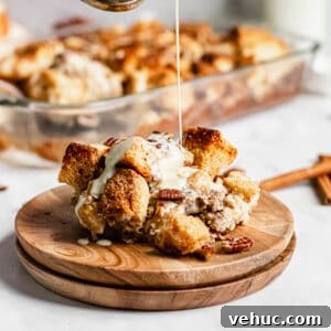 Pecan Bread Pudding with Creamy Vanilla Sauce 16 Bourbon sauce being poured onto the bread pudding
