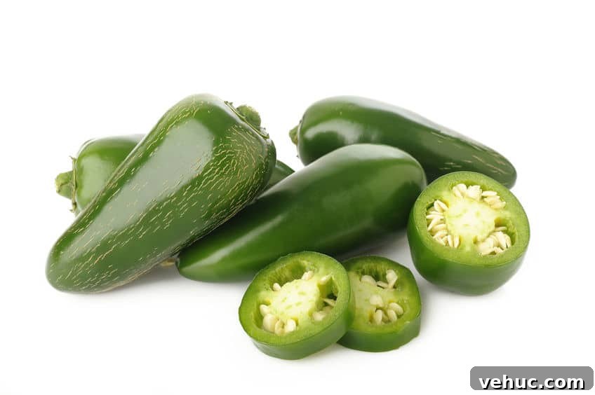 Instant Pot Mexican Picadillo Recipe (Gluten-Free) 5 Green jalapenos on a white background © 123rf.com by phloenphoto