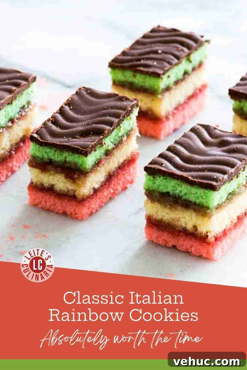 Classic Italian Rainbow Cookies Recipe You’ll Love 3 Stacked Italian rainbow cookies with green, yellow, and pink layers, raspberry jam, and a chocolate topping.