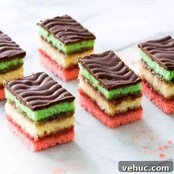 Classic Italian Rainbow Cookies Recipe You’ll Love 9 Six Italian rainbow cookies on a marble slab