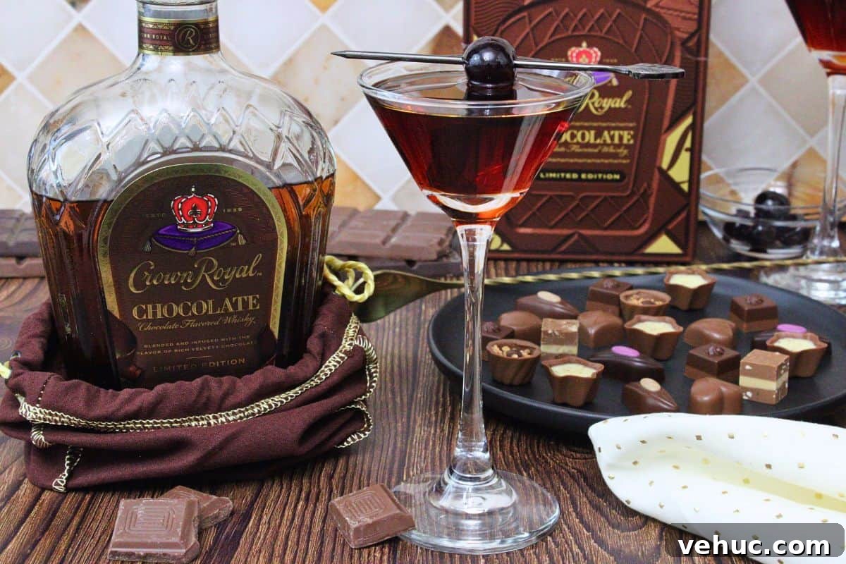 12 Irresistible Chocolate Crown Royal Cocktails to Try Tonight 10 chocolate manhattan cocktail in coupe glass with cherry skewer next to chocolate crown royal bottle and chocolate candies