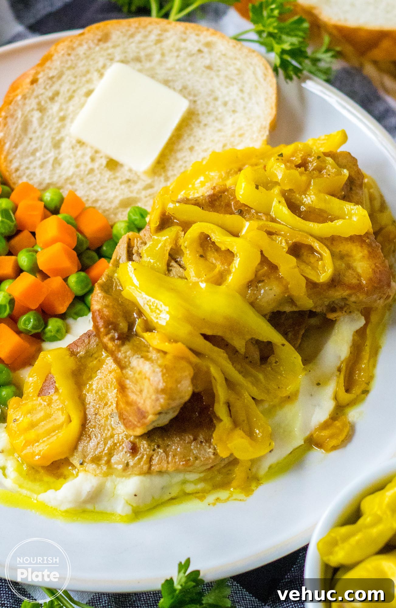 Mississippi-Style Slow Cooker Pork Chops You’ll Love 2 Mississippi pork chops plated with steamed vegetables and toast with butter