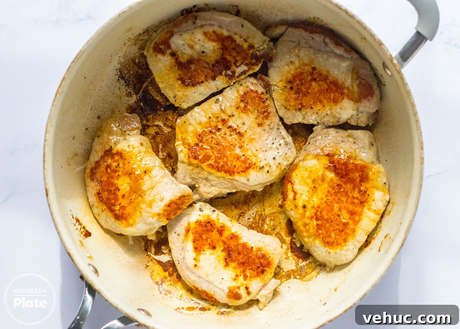 Mississippi-Style Slow Cooker Pork Chops You’ll Love 4 Browned pork chops in a frying pan