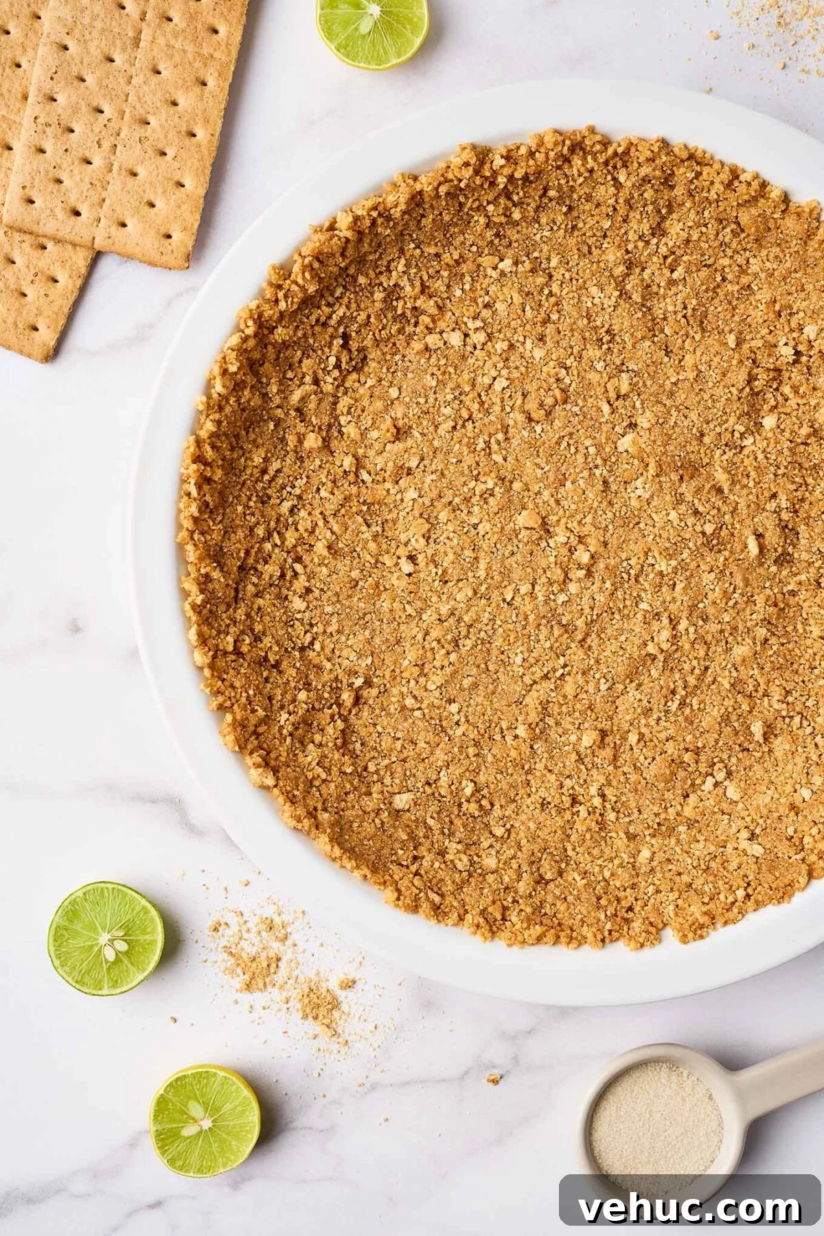 Authentic Florida Key Lime Pie Recipe You’ll Love 4 Graham cracker crust pressed into pie plate for Florida Key lime pie, ready to bake.