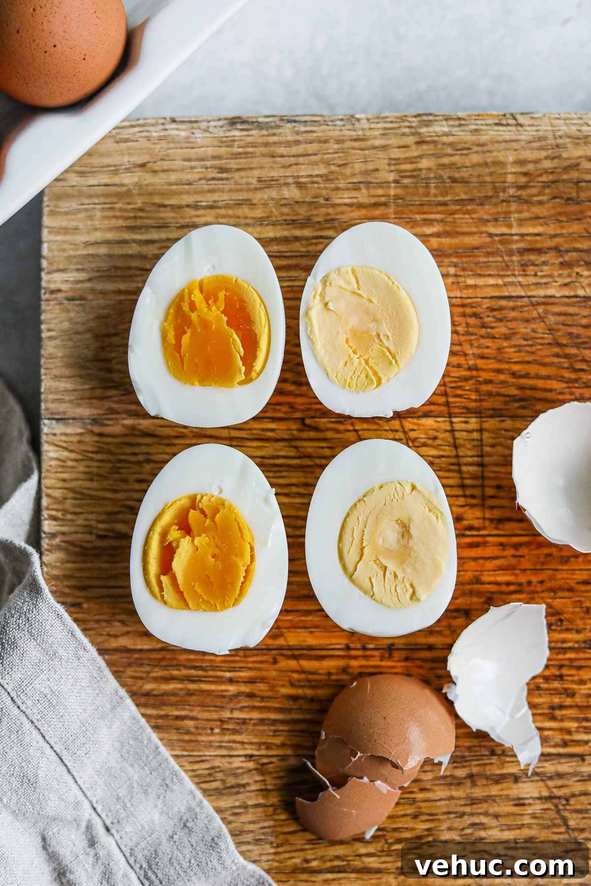 Perfect Hard-Boiled Eggs: Foolproof Method for Tender Yolks 5 Sliced hard boiled eggs with orange soft yolks (9 minutes) and creamy yellow yolks (12 minutes).