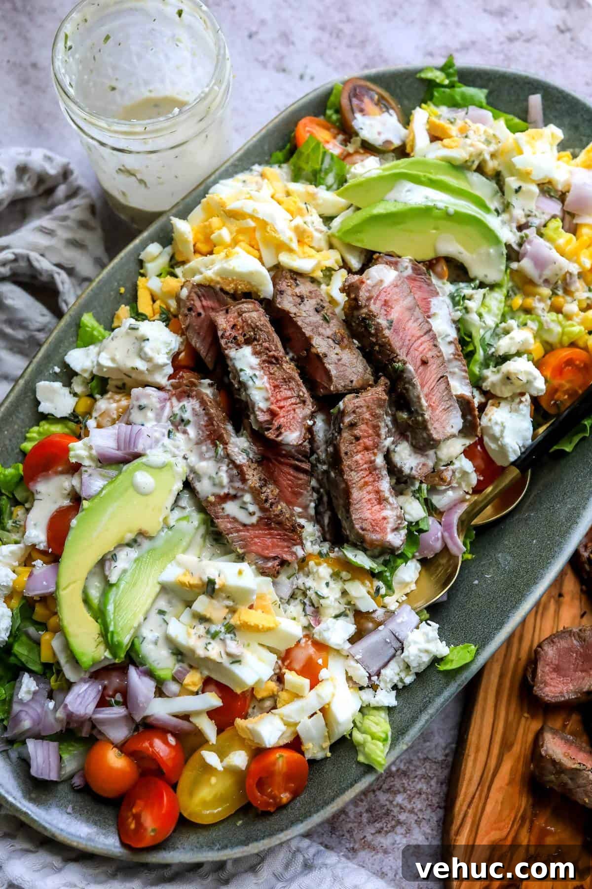 Grilled Steak Salad with Balsamic Vinaigrette Recipe 2 steak salad and hard boiled eggs on top.
