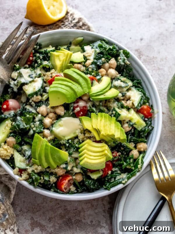 Grilled Steak Salad with Balsamic Vinaigrette Recipe 6 White bowl with kale and chickpeas, loads of veggies and dressing on the top.
