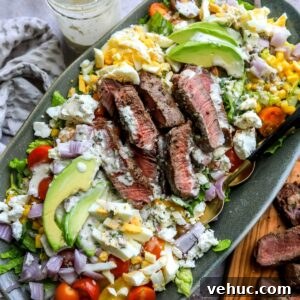 Grilled Steak Salad with Balsamic Vinaigrette Recipe 10 Large serving platter with chopped salad and grilled steak.