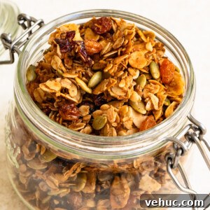 Glass canister filled with baked granola.