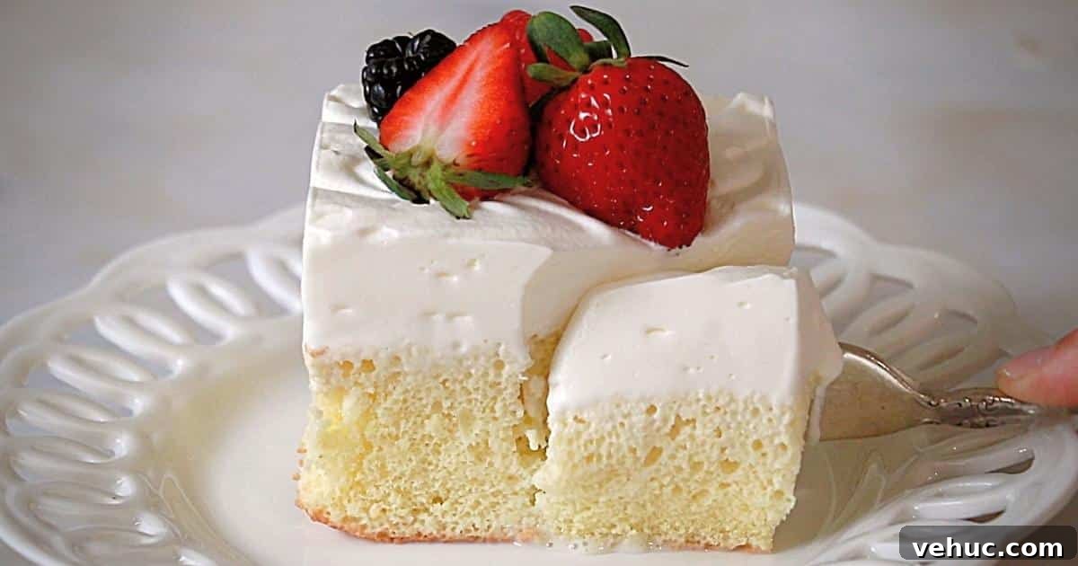 Authentic Tres Leches Cake Recipe: Moist Latin-Style Dessert 4 cutting a tres leches cake on a plate with a fork