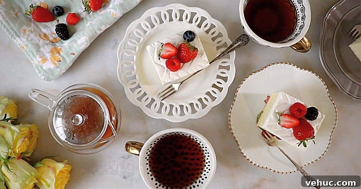 Authentic Tres Leches Cake Recipe: Moist Latin-Style Dessert 6 tres leches cakes on plates with teas, berries and flowers