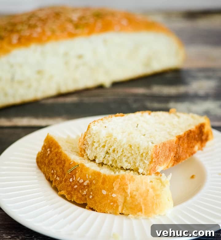 Rustic sliced rosemary bread rustic rosemary bread sliced on a plate