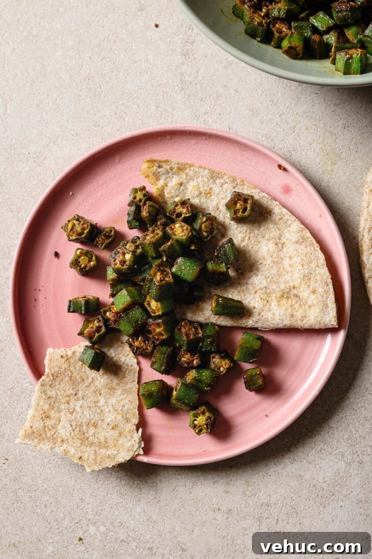 15-Minute Indian-Style Bhindi Fry Recipe for Crispy Okra 2 Partially eaten plate of Bhindi Fry with roti.