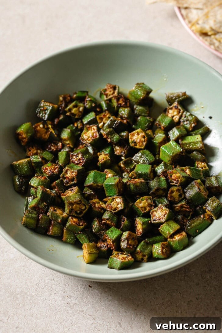 15-Minute Indian-Style Bhindi Fry Recipe for Crispy Okra 14 Bhindi Fry in a light blue bowl.