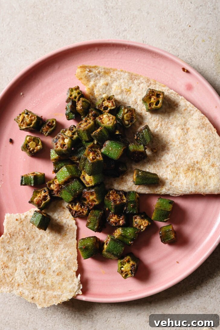15-Minute Indian-Style Bhindi Fry Recipe for Crispy Okra 15 Partially eaten plate of Bhindi Fry with roti.