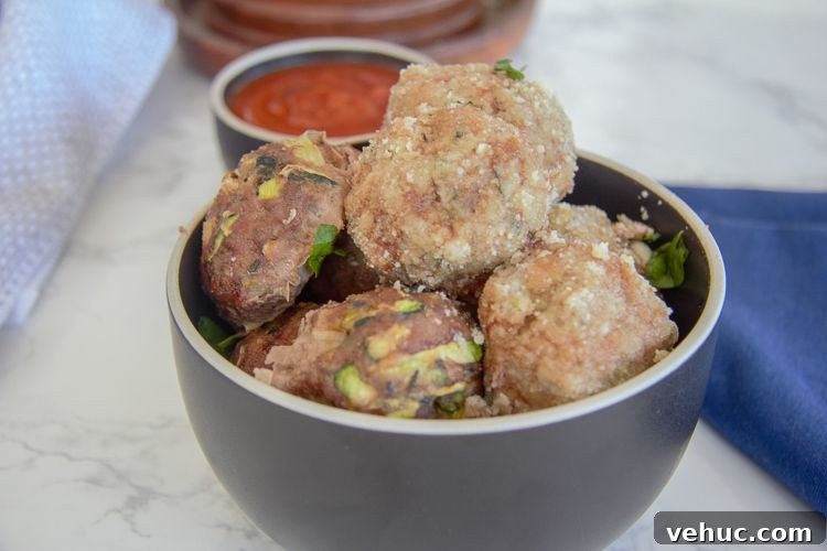 Zucchini Chicken Meatballs with Garlic and Herbs 3 meatballs made with ground chicken and grated zucchini
