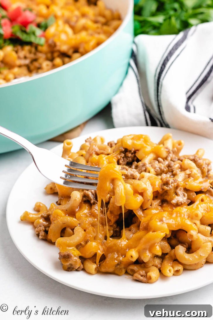 A portion of the casserole being eaten with a fork.