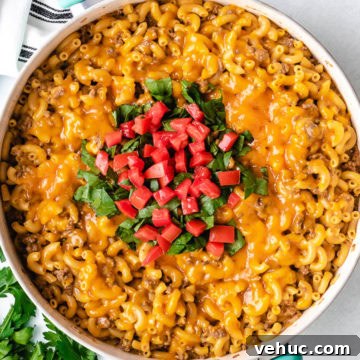 Close up view of a skillet of cheeseburger casserole.