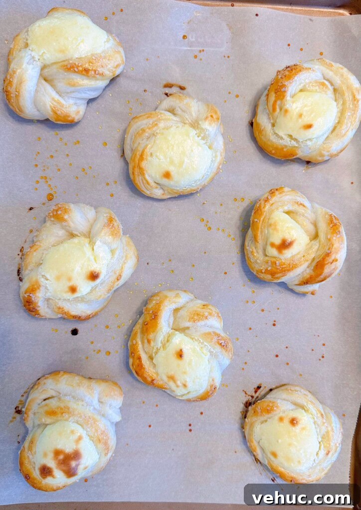 Cherry Cream Cheese Knots: Sweet Stuffed Pastry Bites for Brunch 10 Puff pastry slightly baked with cream cheese puffed in the center.