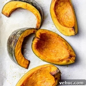 golden brown roasted kabocha squash wedges on parchment paper