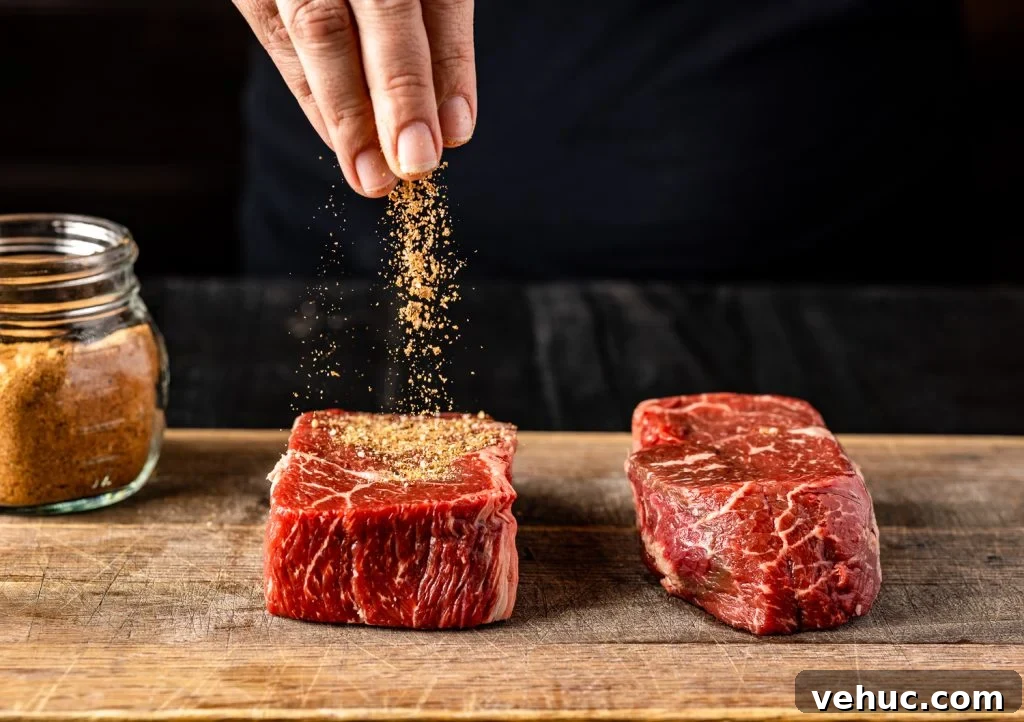 Montreal Steak Seasoning: How to Make and Use It for Perfect Steaks 5 Montreal steak seasoning being sprinkled on a steak.