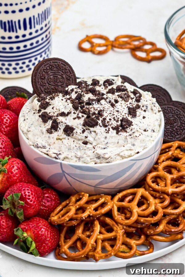 Baked Brie with Honey and Crispy Puff Pastry 8 Strawberries, pretzels, and cookies around an Oreo dip.