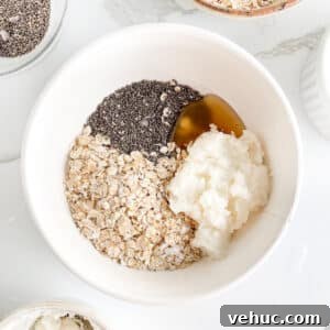 Creamy Cottage Cheese Overnight Oats Recipe for Breakfast 9 Ingredients for cottage cheese overnight oats in a bowl, before adding milk and mixing