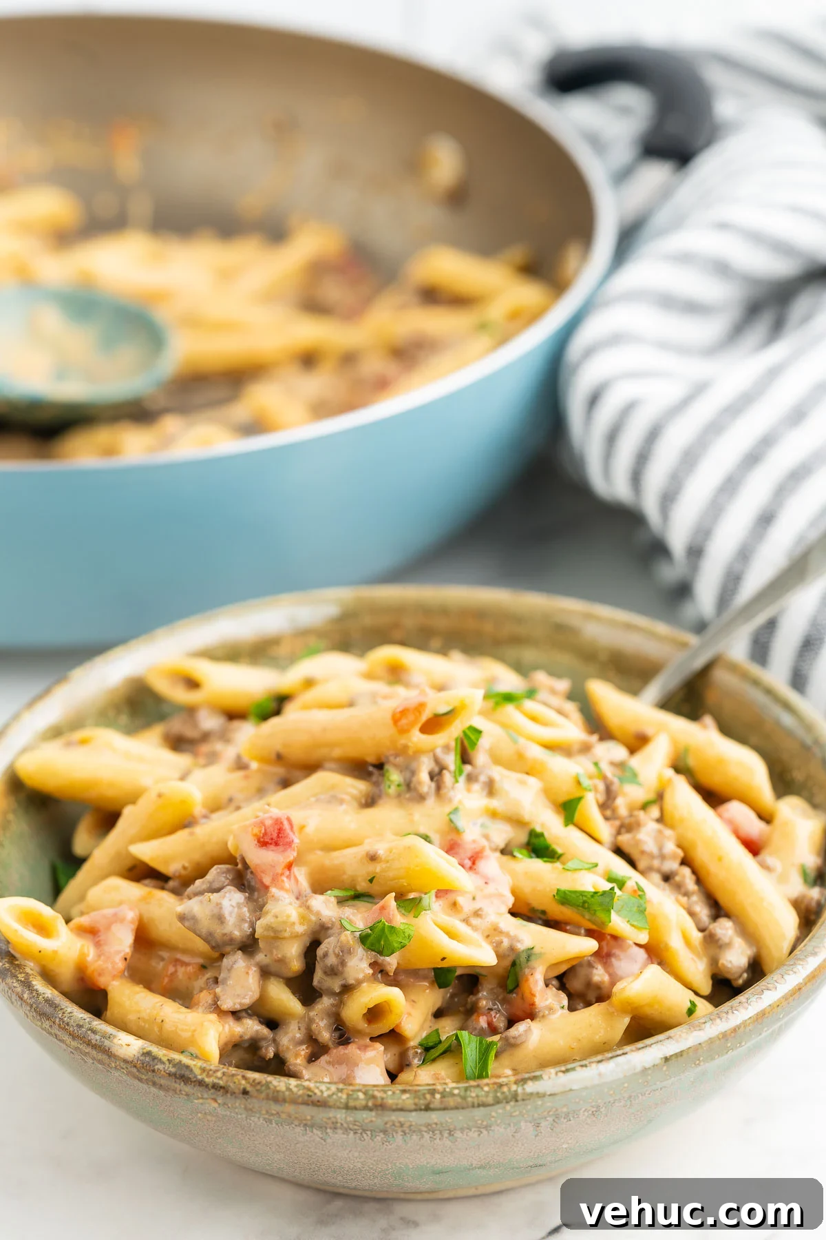 Creamy Rotel Pasta Recipe with Tomatoes and Sausage 8 Scoop of cheesy pasta with Rotel tomatoes and green chilies