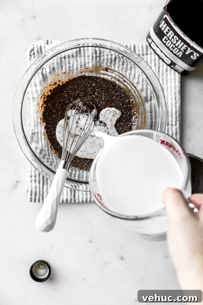combine chia seeds, maple syrup, and cocoa powder, then pour in milk