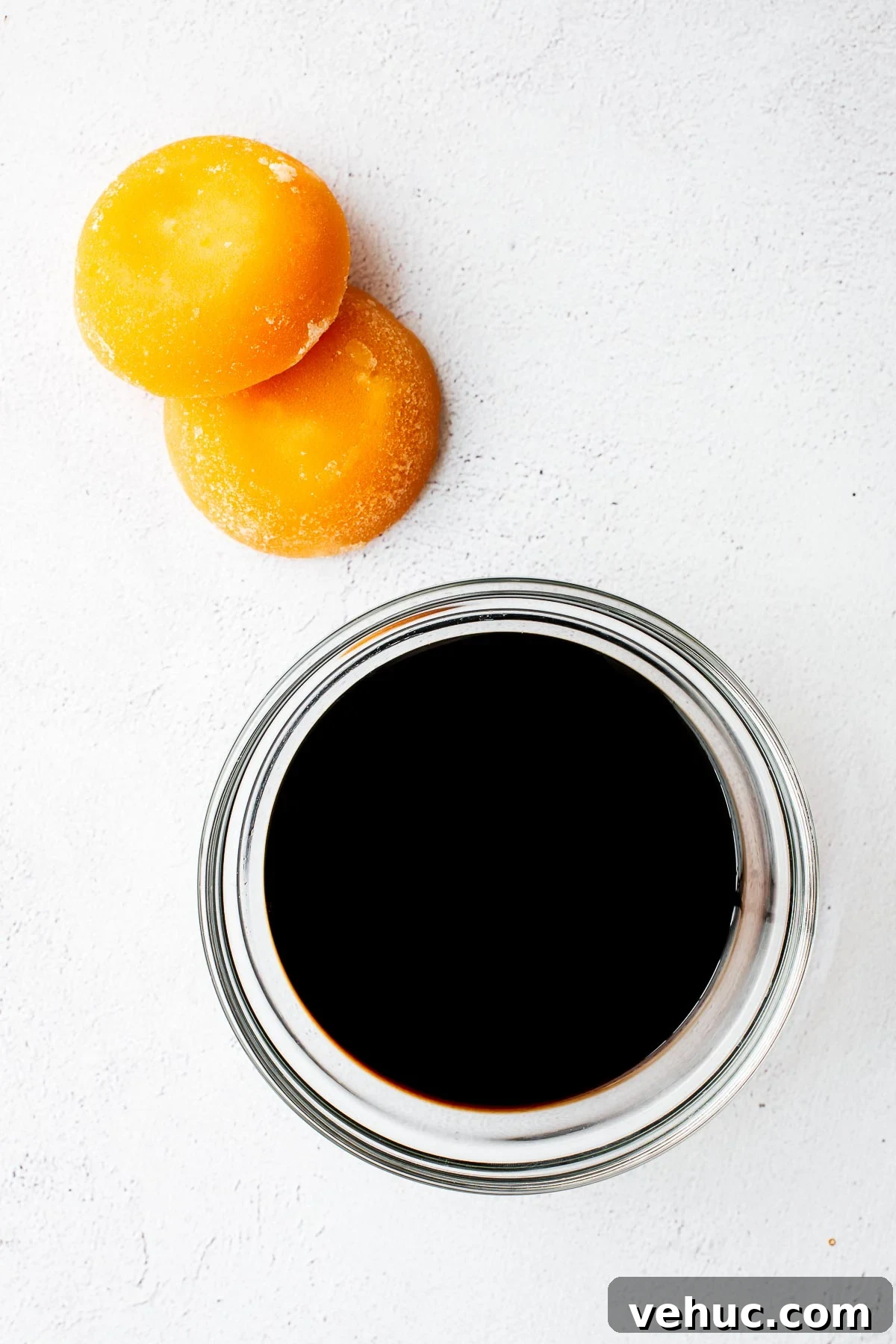 Kecap Manis Substitute: How to Make Sweet Soy Sauce at Home 5 A bowl of all-purpose soy sauce and palm sugar bricks for homemade kecap manis.