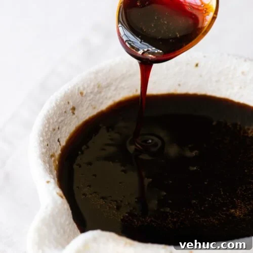 Kecap Manis Substitute: How to Make Sweet Soy Sauce at Home 7 Homemade sweet soy sauce substitute (Indonesian kecap manis) drizzling from a teaspoon into a soy sauce pourer.