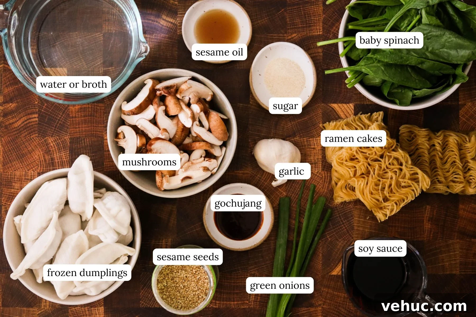 Crispy Baked Dumplings with Ramen: One-Pan Weeknight Dinner 3 Recipe ingredients for baked dumplings with ramen including gochujang, garlic, soy sauce, sesame oil, mushrooms, spinach, ramen cakes, and frozen dumplings.