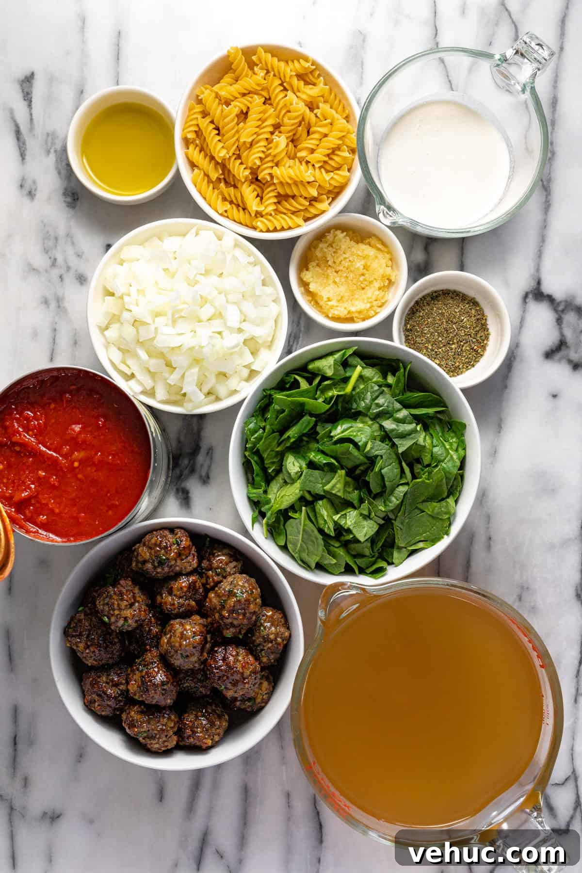 Creamy Italian Meatball Soup: Cozy Weeknight Recipe 3 White marble counter top with bowls of ingredients to make creamy meatball soup.