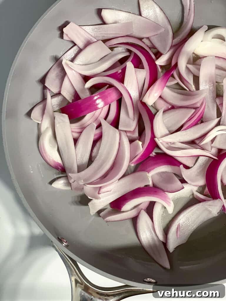 Crispy Garlic Zucchini Stir-Fry Recipe for Weeknight Meals 6 sliced onions in a pan