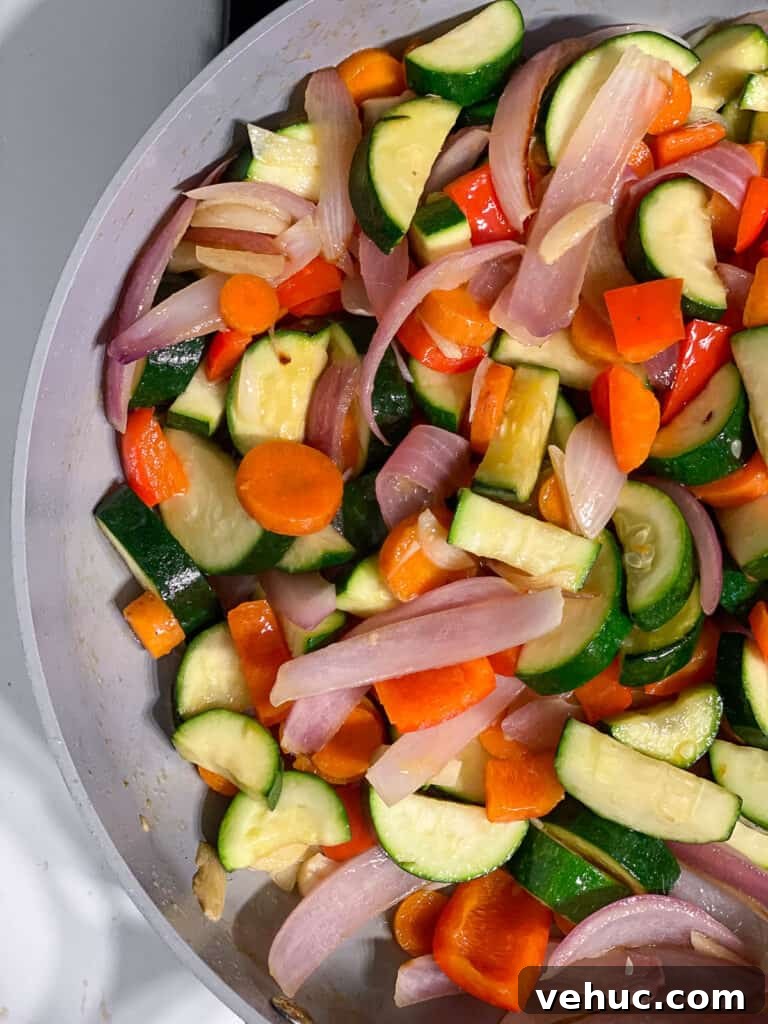 Crispy Garlic Zucchini Stir-Fry Recipe for Weeknight Meals 7 process shot of veggies cooking in a pan