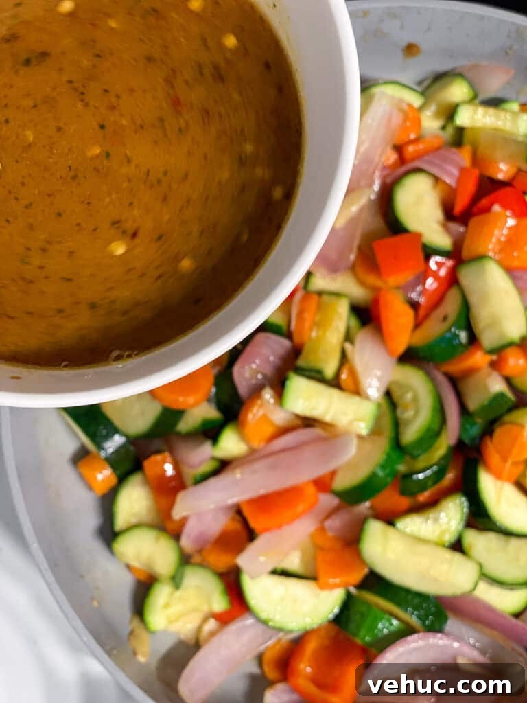 Crispy Garlic Zucchini Stir-Fry Recipe for Weeknight Meals 8 process shot of adding sauce to pan