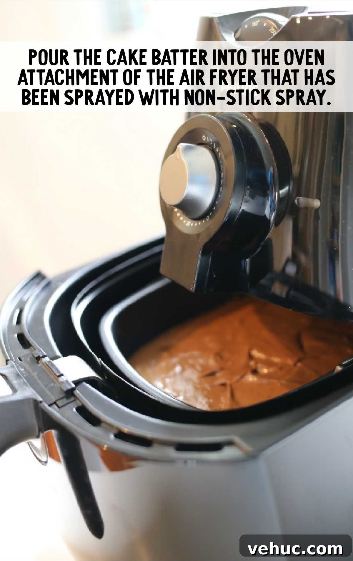 Air Fryer Chocolate Cake process shot of cake batter placed into the air fryer