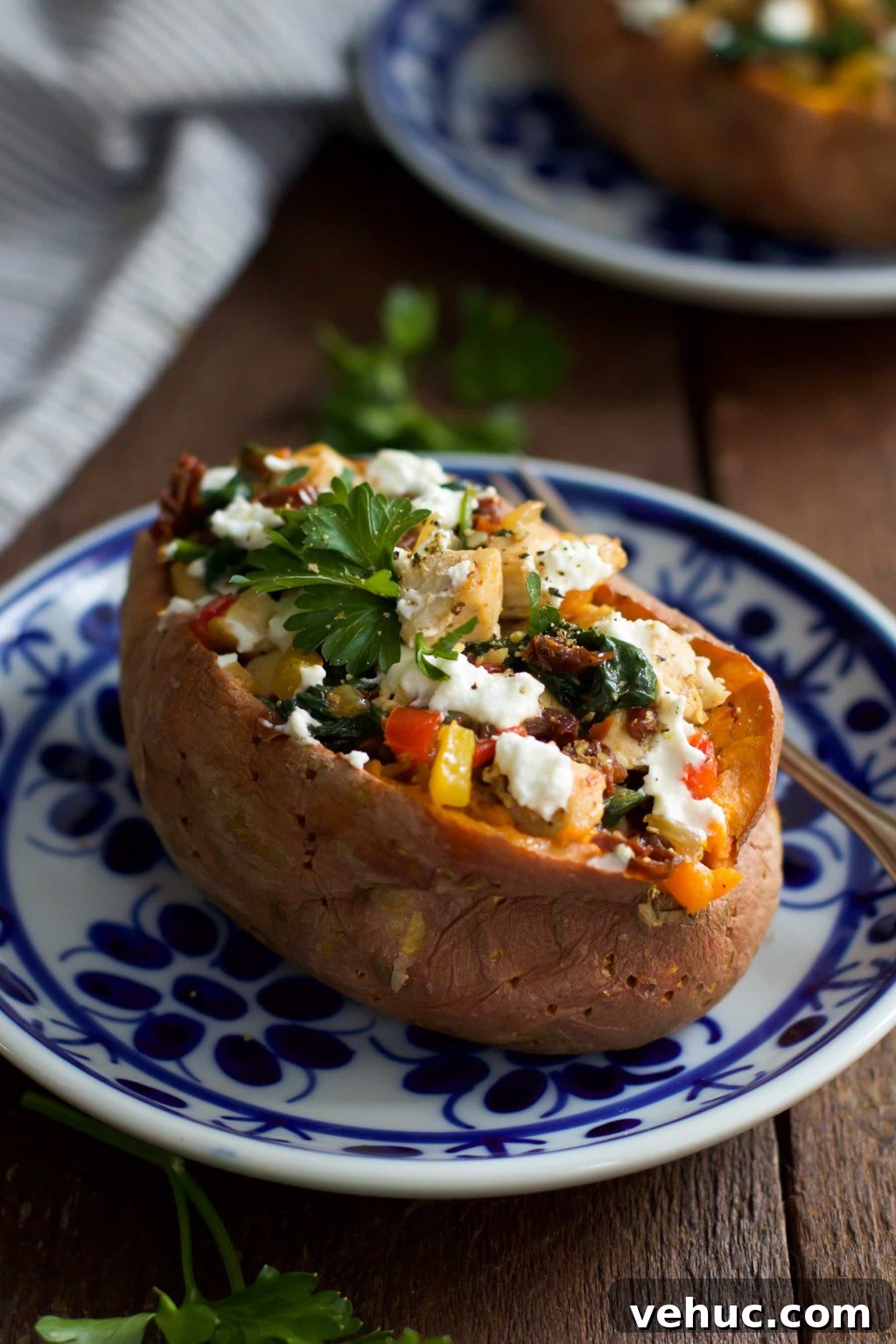 Goat Cheese Chicken Stuffed Sweet Potato_- This ultra-easy to make Goat Cheese Chicken Stuffed Sweet Potato recipe is healthy, filling and delicious. It is made with spinach, chicken, garlic, onions, bell peppers and goat cheese. This is definitely a perfect meal for chilly winter nights that requires simple ingredients. Goat Cheese Chicken Stuffed Sweet Potato Primavera Kitchen Recipe