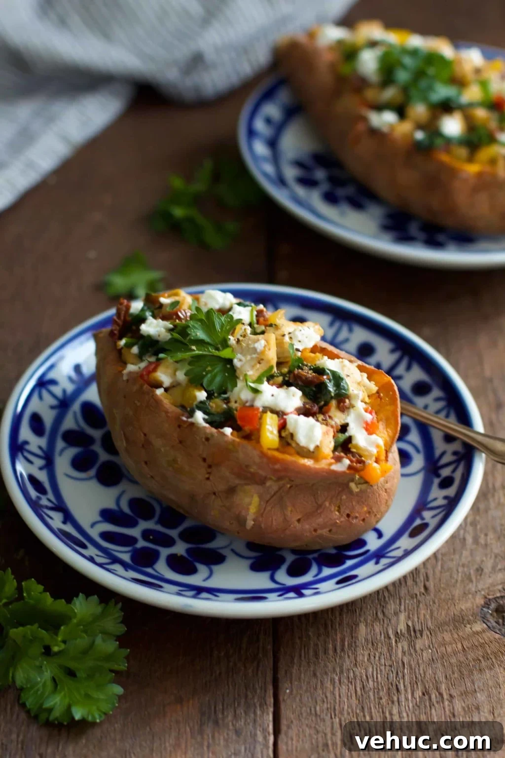 Goat Cheese Chicken Stuffed Sweet Potato_- This ultra-easy to make Goat Cheese Chicken Stuffed Sweet Potato recipe is healthy, filling and delicious. It is made with spinach, chicken, garlic, onions, bell peppers and goat cheese. This is definitely a perfect meal for chilly winter nights that requires simple ingredients. Chicken Stuffed Sweet Potato