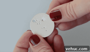 How to Make Stamped Constellation Necklaces (Video) 16 hand holding stamped metal