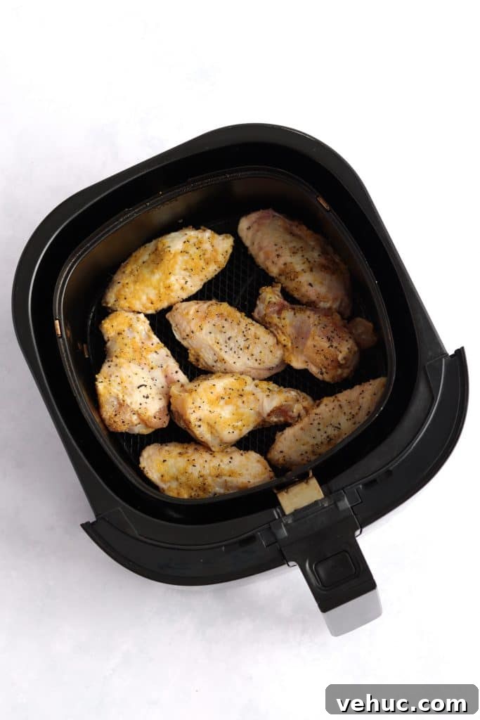Crispy Air Fryer Chicken Wings Recipe for Perfectly Golden Wings 4 raw chicken wings in air fryer
