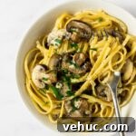 Creamy Garlic Mushroom Pasta Recipe — Quick Weeknight Comfort 14 A close up view of a bowl of creamy mushroom pasta.
