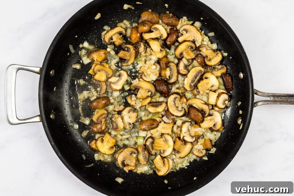 Creamy Garlic Mushroom Pasta Recipe — Quick Weeknight Comfort 6 Cooking wine off the mushrooms.
